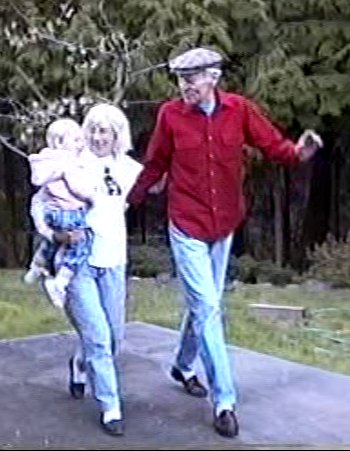Dona and Hal dancing with granddaughter Hannah